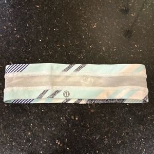 LuluLemon head band with inner grip to hold in place. Mesh accent in center
